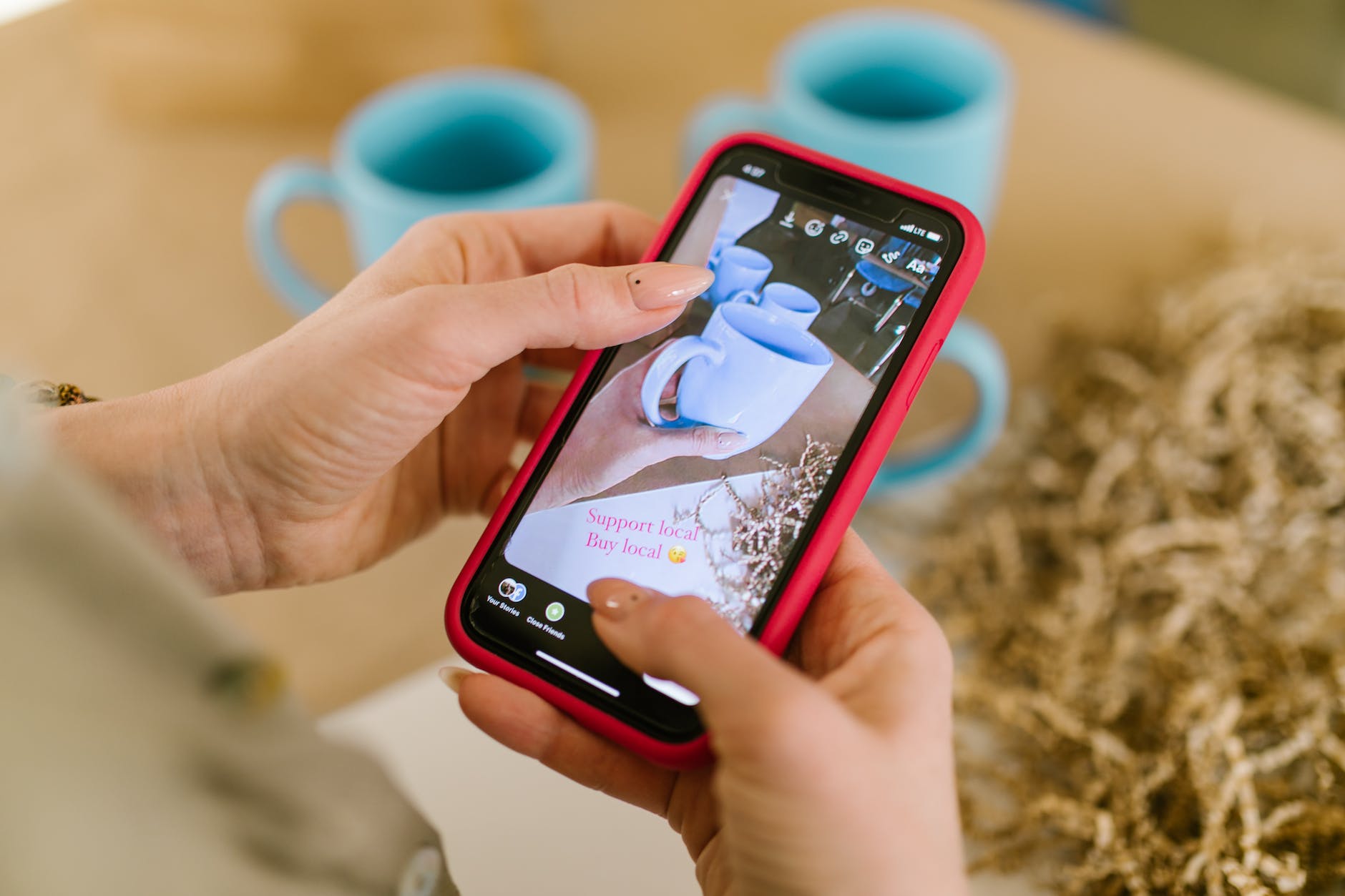 image of ceramic cups on smartphone screen